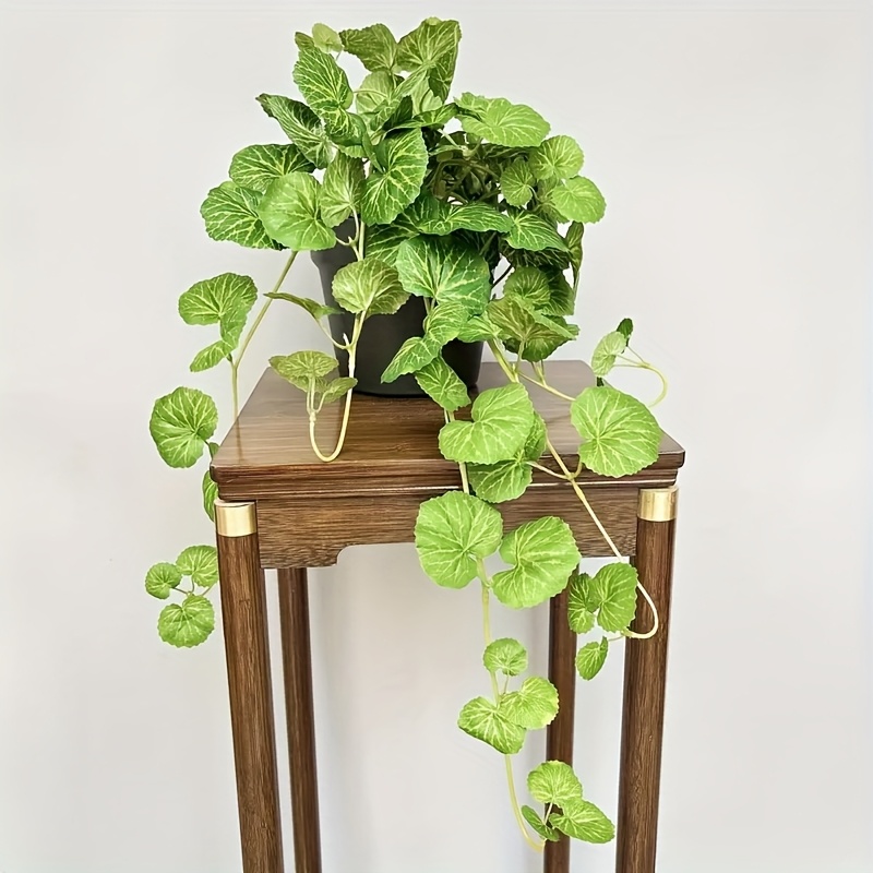 Pilea Peperomioides - An artificial hanging vine plant, featuring